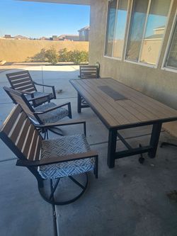 Patio dining table with 4 chairs and a bench