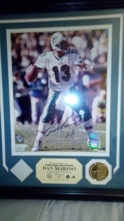 Dan Marino sighned limited edition picture .gold coin and piece of game worn jersey with certificate of authinticity