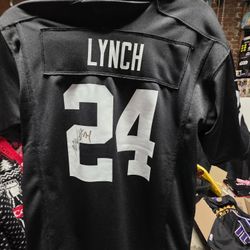 Marshawn Lynch Autographed Signed Las Vegas Raiders Youth Large Football Jersey On Field