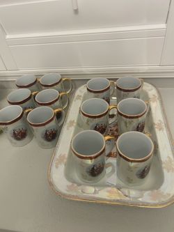 A set of 12 cups and Trey