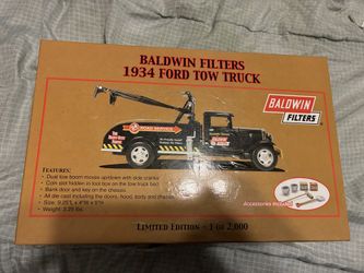 This is a limited edition Baldwin Filters 1934 Ford Tow Truck diecast model and coin bank, part of a series of 2,000.
