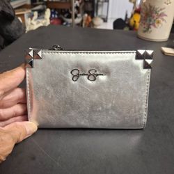 Jessica Simpson Frankie Wallet Features Metallic Silver Look Finish W/Corner Studs, Embossed Logo & Zipper & Snap Closures, Center Divider 6 X 4 Close