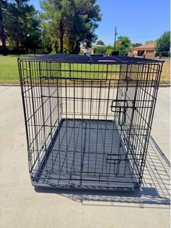 Dog kennel - crate. Size M $25 Medium elevated dog feeder $10. Both $30 or BO