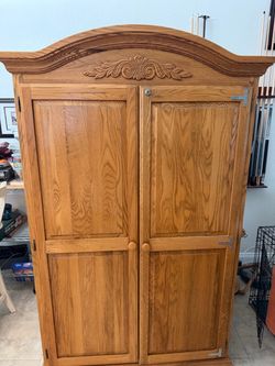 Oak Wood Armoire with Carved Crown Detail