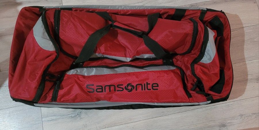 Samsonite Red and Black Rolling Duffel Bag