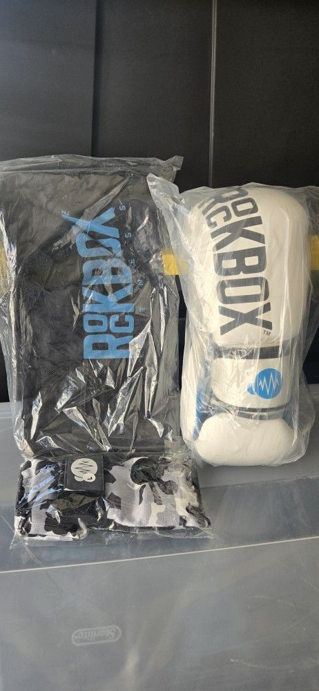 Rockbox Fitness Fighting / Sparring Boxing Gloves & Patterned Boxing Wrap Gloves & Bag
$32 for 1 set