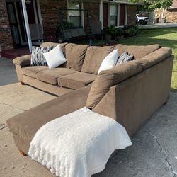 Super comfortable Mocha brown large sectional in used condition Slightly Damaged