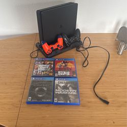 PS4 w/ power cord + 2 controllers