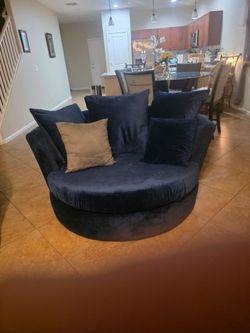 Blue Velvet sectional couches and a matching  Oversized Swivel round chair