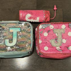 TWO JUSTICE GLITTER LUNCH-BOXES AND WATER BOTTLE HOLDER USED