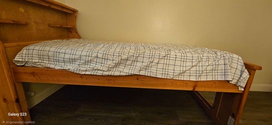 Twin captains bed. With bookcase headboard