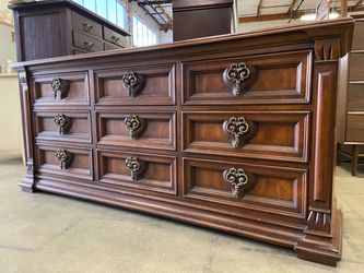 DREXEL Estorada Colonial Style Triple Dresser with Carved Drawer Fronts and Ornate Knocker Drawer Pulls