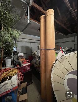 2 Large, unfinished wooden columns