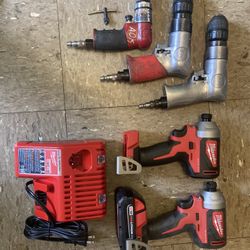 2 Milwaukee Impact Drills With One Battery And Charging Station140$,little Red Sioux Air Gun 150$,silver Sioux Air Drills 100$ Each