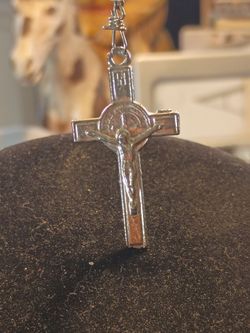 Rosary with blue sky crystals and silver angel wings and also has a silver cross with Jesus and a silver medallion on it