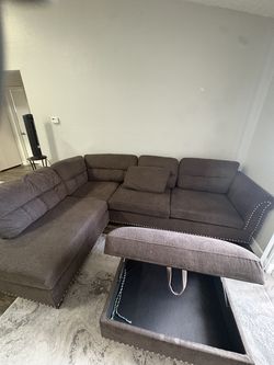 Brown L shaped sofa