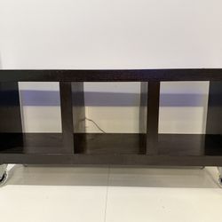 REDUCED: Pottery barn espresso wood storage or bench with modern rubber wheels ( 3 basket storage areas) (48’’ x 14’’ X 22’’ )