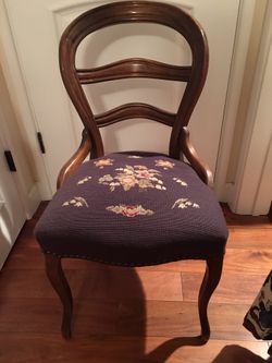 Antique wood chair with needlepoint seat