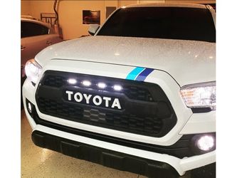 White Raptor Lights for Toyota Tacoma TRD pro grille.