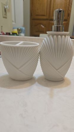 Bathroom soap dispenser and tooth brush holder