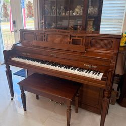 Baldwin walnut upright piano