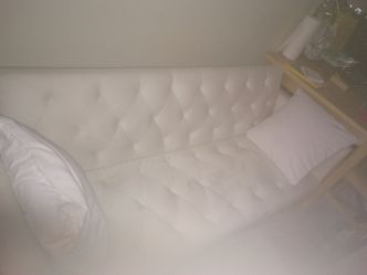 Clean white retro styled sofa / futon bed