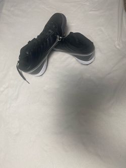 Nike Black and White High-Top football cleats