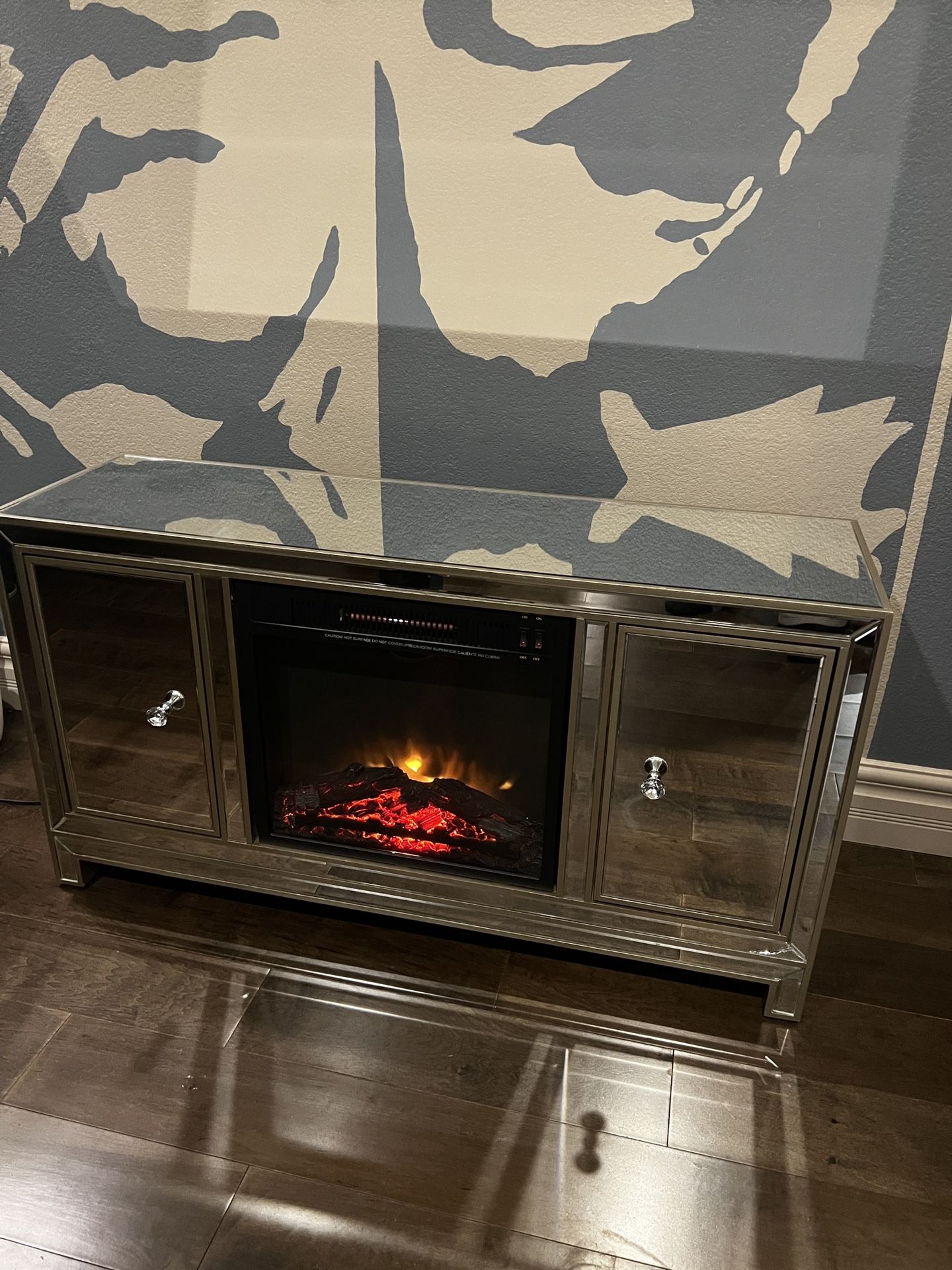 Mirrored Tv console Holds up to 65” Tv with built in electric fireplace 