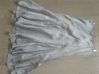 Satin skirt. Really nice and elegant. The length is pass knees
