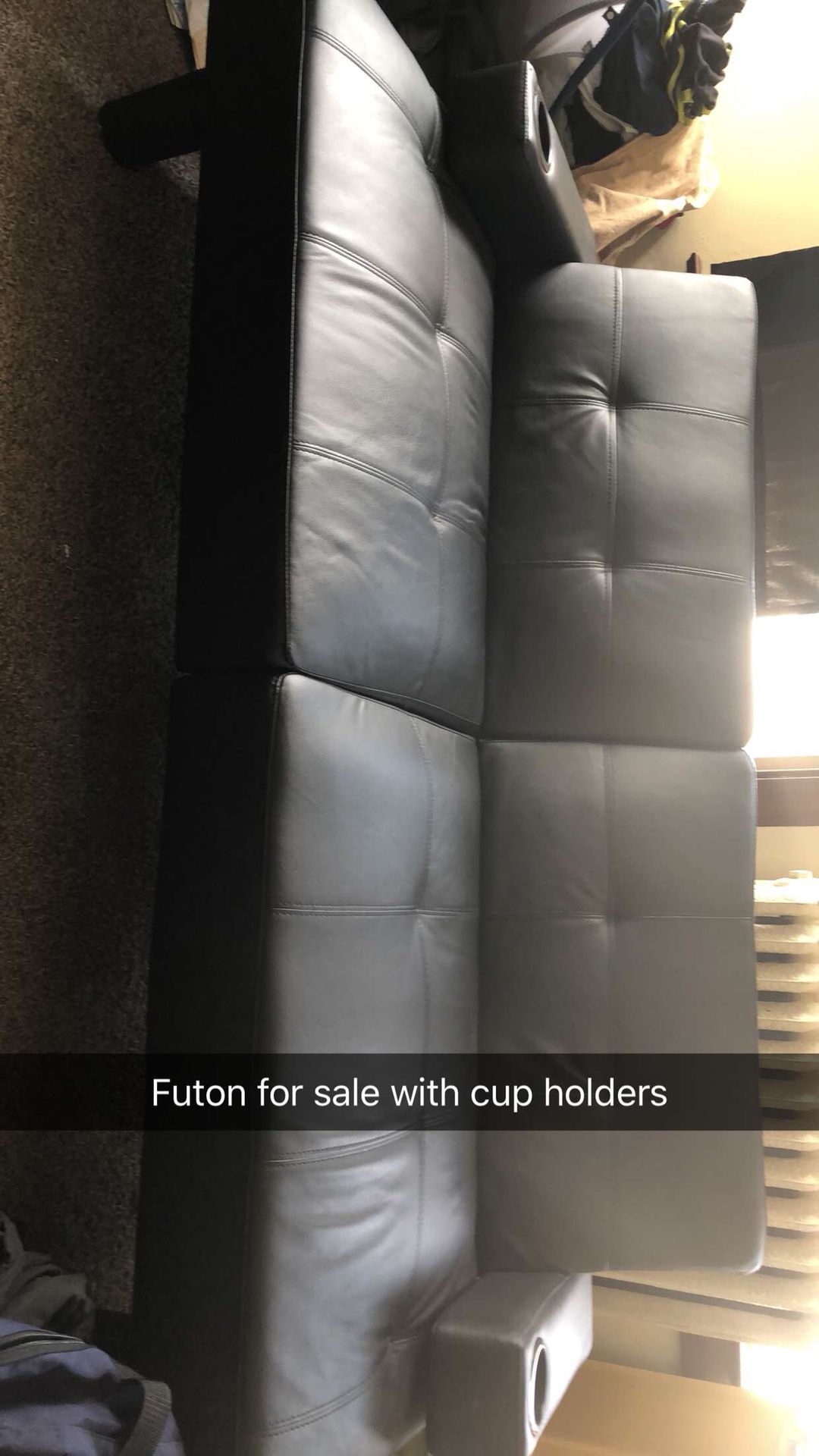 Black leather futon with cup holders