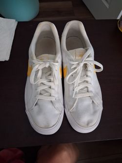 Nike White Low-Top Sneakers with Yellow Swoosh