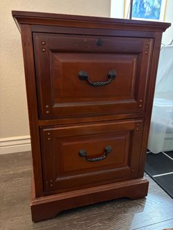 Wooden file cabinet - accommodates legal documents / on wheels