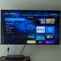 43" TCL 4k smart TV with wall mount, feet, and antenna