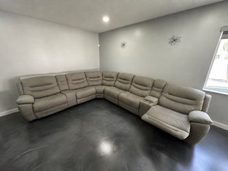 Reclining Sofa In A Sleek Gray Microfiber
