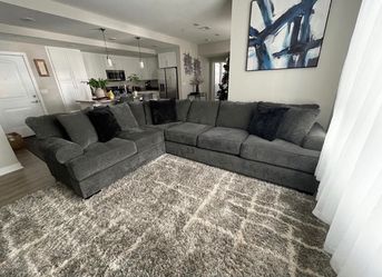 Grey oversized sectional with ottoman
