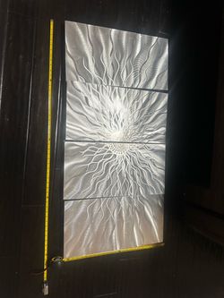 etched metal artwork of a sunflower