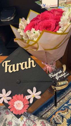 Pipe cleaners flowers with name “Graduation hat”