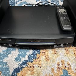 Panasonic VHS Player/ Recorder W/Remote, VHS Cassettes And Storage Boxes