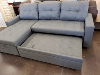 Grey sofa chaise sectional with pull out bed