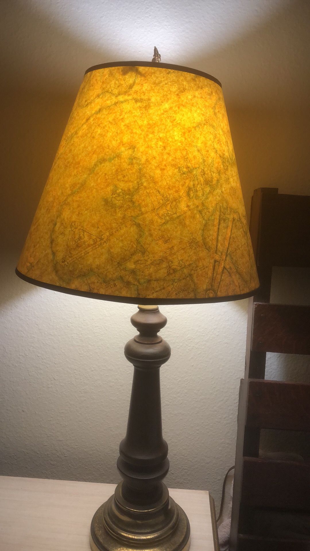 World map lamp with iron dragon top