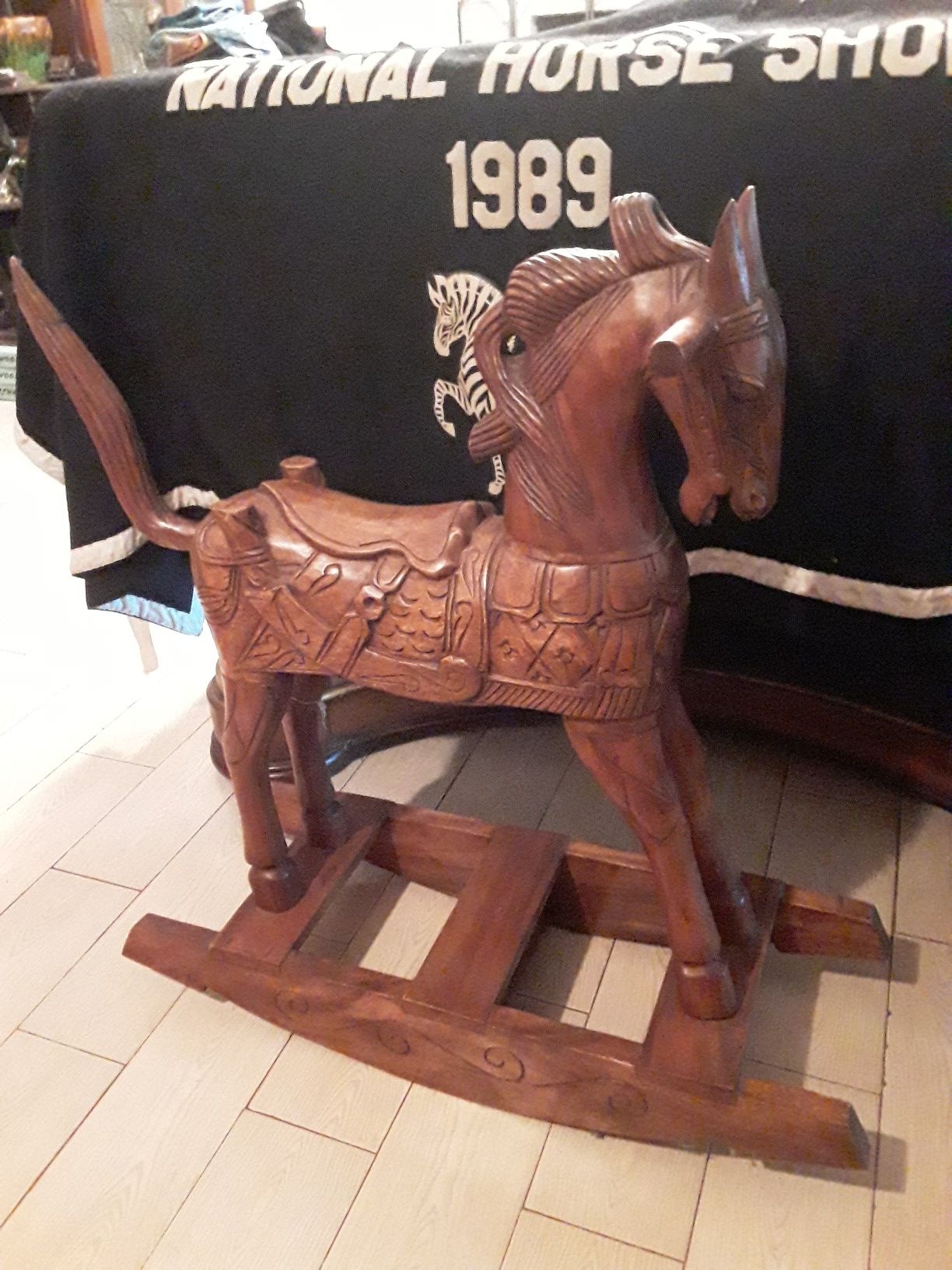 Solid wood hand carved rocking horse.