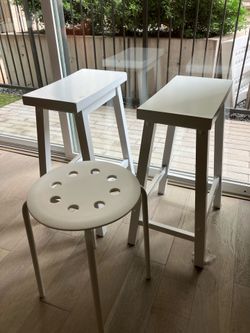White Saddle-Seat Barstool and IKEA Round Chair