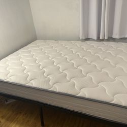 Excellent condition queen 10 inch medium firm mattress with Euro top from guest room