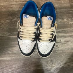 Nike Air Jordan 1 Retro Low OG SP Fragment Design x Travis Scott sneaker in the white, black, and royal blue colorway. 