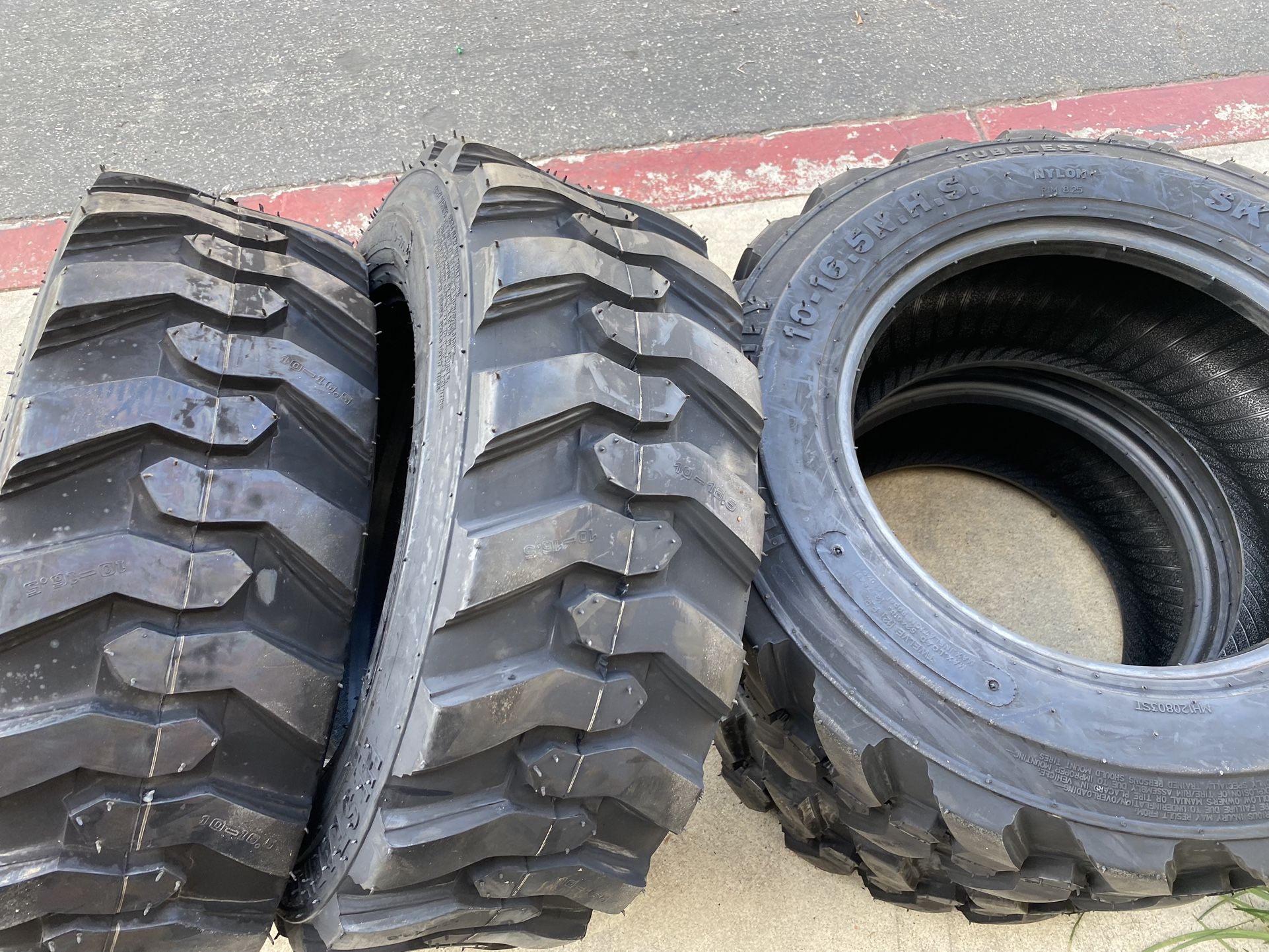 SET of 4 NEW 10-16.5 skid steer tire 12 ply no lowball