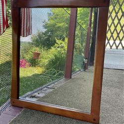 Mid - century heavy maple mirror. Made by “Famous Reproductions of Old New England Furniture “