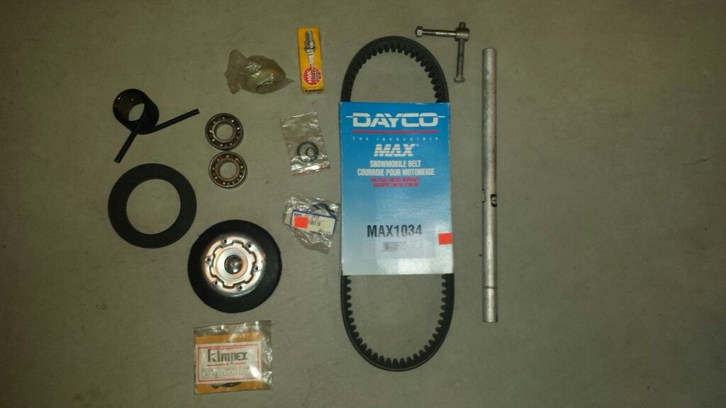 Snowmobile drive belt, bogie wheel and parts