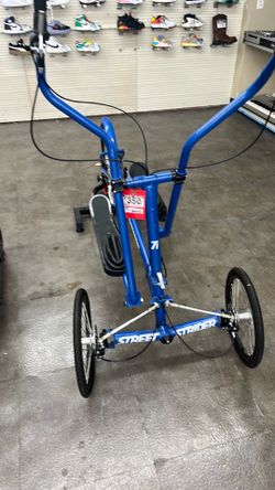 This blue StreetStrider 7i outdoor elliptical bike