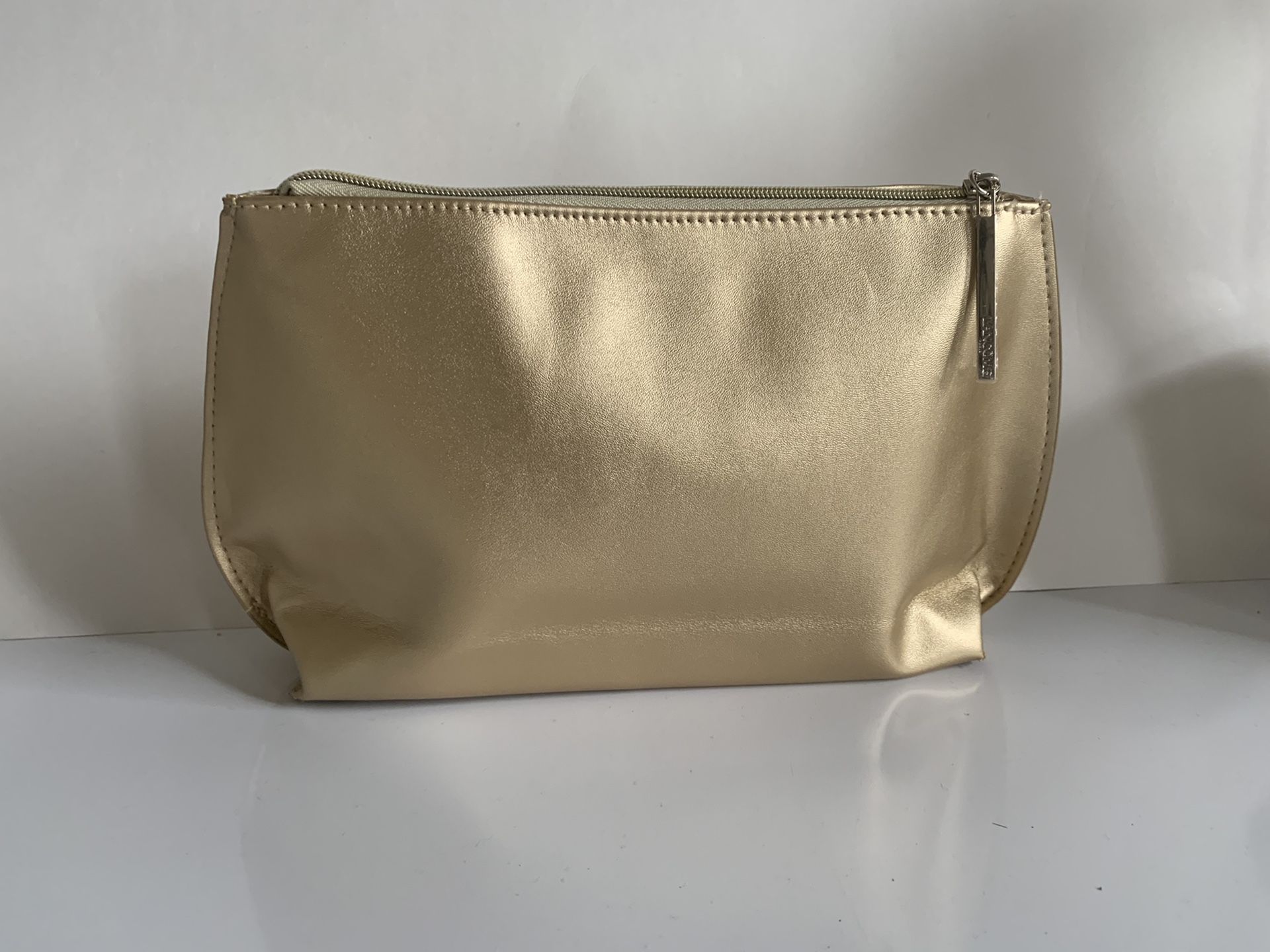 Lancôme Paris gold color gorgeous cosmetic bag. 12”X 6.5”and 2.5”