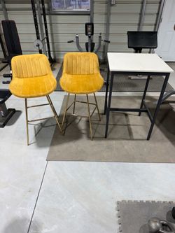Two chairs and tall table.